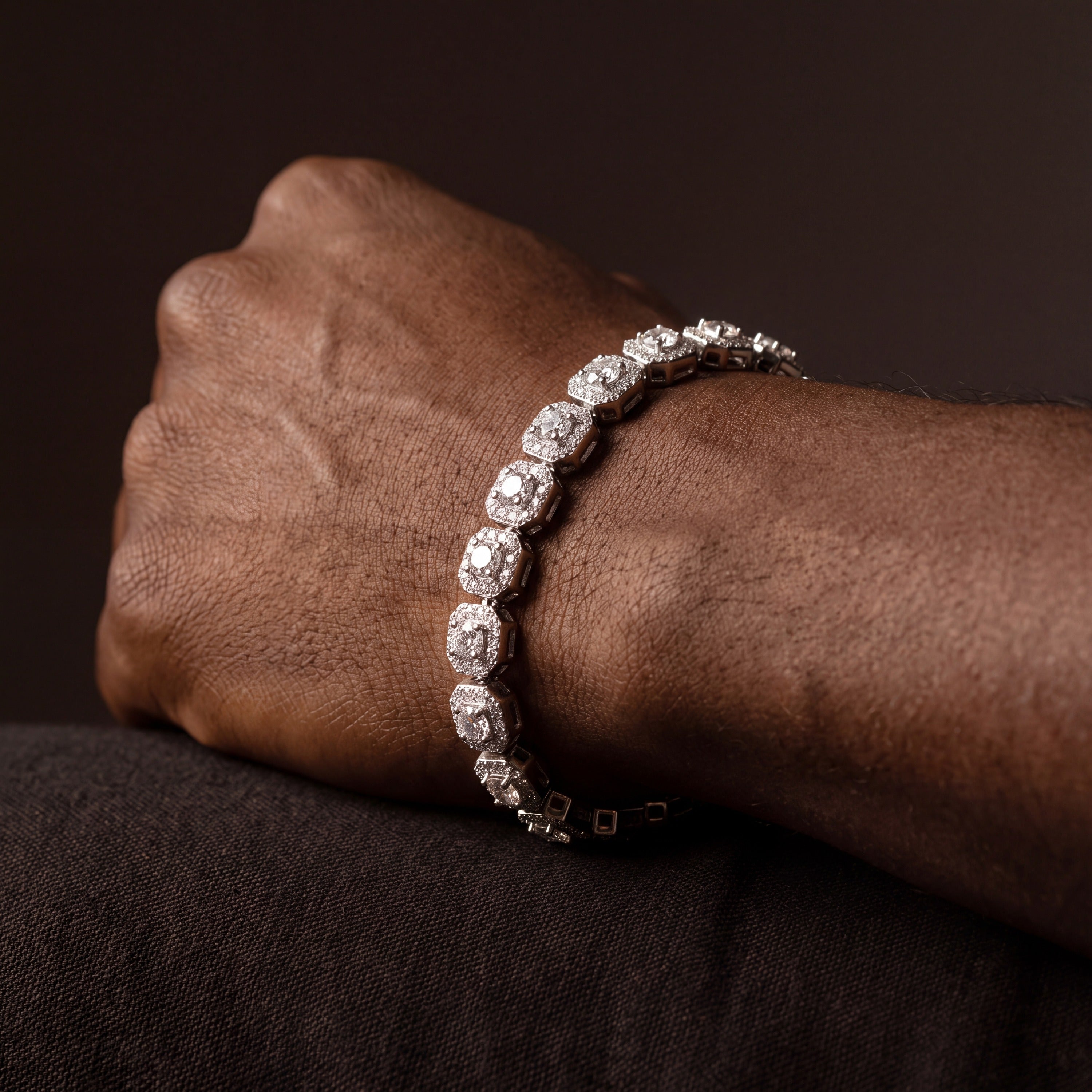 Cluster tennis bracelet seen along the wrist from a second angle